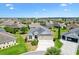 Expansive aerial view of a single-Gathering home with well-manicured lawn in a sunny neighborhood at 3405 Nursery Pl, The Villages, FL 32163
