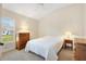 Cozy bedroom featuring neutral paint, carpeting, and double hung windows at 3405 Nursery Pl, The Villages, FL 32163