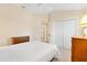 A comfortable bedroom features neutral paint, carpeting, and ample storage at 3405 Nursery Pl, The Villages, FL 32163