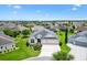 Beautiful single-story home featuring a lush lawn, landscaped beds, and a two-car garage in a well-maintained neighborhood at 3405 Nursery Pl, The Villages, FL 32163