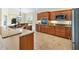 Spacious kitchen with stainless steel appliances, granite countertops, and wood cabinets at 3405 Nursery Pl, The Villages, FL 32163