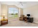 Well-lit home office featuring a vaulted ceiling, a large window and neutral colors at 3405 Nursery Pl, The Villages, FL 32163