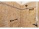 Shower features a tiled design and a built-in shelf and a grab bar at 3405 Nursery Pl, The Villages, FL 32163