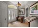 Charming entryway with a decorative glass front door, and bench at 3411 Eisenhower Way, The Villages, FL 32163
