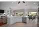 Modern kitchen with an island and stainless-steel appliances at 3411 Eisenhower Way, The Villages, FL 32163