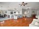 Open-concept living area with stylish furnishings, hardwood floors, and abundant natural light, creating a cozy atmosphere at 3411 Eisenhower Way, The Villages, FL 32163