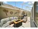 Outdoor patio area with comfortable seating, fire pit, and stylish decor, perfect for entertaining or relaxation at 3411 Eisenhower Way, The Villages, FL 32163