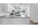 Kitchen featuring stainless steel appliances, white cabinets, and granite countertops at 40685 E Ninth Ave, Umatilla, FL 32784