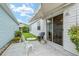 Backyard patio with awning, seating and barbeque, ideal for outdoor relaxation and entertaining at 412 Hildalgo Dr, The Villages, FL 32159