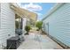 Backyard patio with awning, seating and barbeque, perfect for outdoor relaxation and entertaining at 412 Hildalgo Dr, The Villages, FL 32159