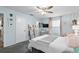 A well-lit bedroom with a fan and a desk by the window at 412 Hildalgo Dr, The Villages, FL 32159