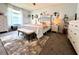 Bright bedroom with a rug, natural light, and white furniture at 412 Hildalgo Dr, The Villages, FL 32159