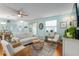 Bright open-concept floor plan with hardwood floors, decorative features, and natural light at 412 Hildalgo Dr, The Villages, FL 32159