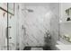 Marble style tile in a glass encased standing shower at 412 Hildalgo Dr, The Villages, FL 32159