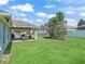 Lush backyard showcasing green lawn and covered patio at 4730 Se 31St St, Ocala, FL 34480