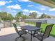 Outdoor patio featuring a dining area overlooking the swimming pool and well-maintained backyard at 4730 Se 31St St, Ocala, FL 34480