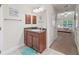 Bathroom featuring a single vanity with a large mirror and decor at 4730 Se 31St St, Ocala, FL 34480