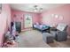 Bedroom featuring pink walls and a neutral carpet at 4730 Se 31St St, Ocala, FL 34480
