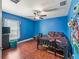 Bright bedroom with hardwood flooring and blue walls at 4730 Se 31St St, Ocala, FL 34480