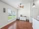 Bright dining area features a large window, cabinet, and hardwood floors at 4730 Se 31St St, Ocala, FL 34480