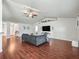 Expansive living area showcasing stylish wood floors, vaulted ceiling, and comfortable seating at 4730 Se 31St St, Ocala, FL 34480