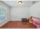 Empty room with wood-style flooring, natural light and a view of the yard at 4730 Se 31St St, Ocala, FL 34480