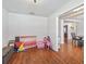 Empty room with wood-style flooring and a view of an adjoining space at 4730 Se 31St St, Ocala, FL 34480