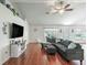 Welcoming living room with vaulted ceiling, wood floors, tv, and comfortable seating at 4730 Se 31St St, Ocala, FL 34480