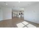 A large living room area featuring tile floors and recessed lighting with an open concept to the kitchen at 5009 Balsam Falls Rd, Deland, FL 32724