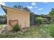 Exterior view of the home with a patio and a garden hose at 501 Cherry Tree St, Eustis, FL 32726