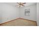 Bright bedroom with window and ceiling fan with carpet flooring at 501 Cherry Tree St, Eustis, FL 32726