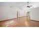 Expansive living space boasting hardwood floors, a vaulted ceiling, and abundant natural light at 501 Cherry Tree St, Eustis, FL 32726