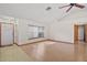 Spacious living area featuring hardwood floors, large window, and neutral paint, creating a bright atmosphere at 501 Cherry Tree St, Eustis, FL 32726