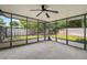 Enclosed patio with fan and lighting, perfect for entertaining or relaxing at 501 Cherry Tree St, Eustis, FL 32726