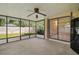 Enclosed patio with fan and lighting, perfect for entertaining or relaxing at 501 Cherry Tree St, Eustis, FL 32726
