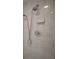 Close-up of tiled shower with shower head and soap dish at 501 Cherry Tree St, Eustis, FL 32726