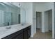 Modern bathroom with double sinks, quartz countertops, and a glass-enclosed shower at 5013 Balsam Falls Rd, Deland, FL 32724