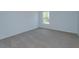 Cozy bedroom with neutral carpet, ample natural light, and a serene atmosphere at 5013 Balsam Falls Rd, Deland, FL 32724