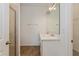 Bathroom featuring double sink vanity, quartz countertops, and tiled shower with glass door at 5017 Balsam Falls Rd, Deland, FL 32724