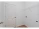 Laundry room with modern tile floors, shelving, and washer and dryer hookups at 5017 Balsam Falls Rd, Deland, FL 32724