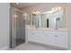 Modern bathroom featuring a glass-enclosed shower and double vanity sinks at 5036 Balsam Falls Rd, Deland, FL 32724