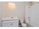 Well-lit bathroom with a single sink vanity and a combined shower and tub at 5036 Balsam Falls Rd, Deland, FL 32724