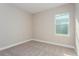 Cozy bedroom with soft carpet and neutral walls, bathed in natural light at 5036 Balsam Falls Rd, Deland, FL 32724