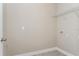 Functional laundry room with washer and dryer hookups and shelving at 5036 Balsam Falls Rd, Deland, FL 32724