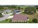 Aerial view of home highlighting its backyard, landscaping, and location near a golf course at 5944 Hickey Way, The Villages, FL 32163