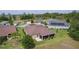 Aerial view showing home's backyard, landscaping, and location in a quiet neighborhood at 5944 Hickey Way, The Villages, FL 32163