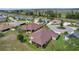 Aerial view of home highlighting its backyard, landscaping, and location within the community at 5944 Hickey Way, The Villages, FL 32163