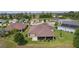 Aerial view showcasing home's backyard, landscaping, and neighborhood setting at 5944 Hickey Way, The Villages, FL 32163