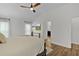 Bright bedroom featuring TV and ensuite access at 5944 Hickey Way, The Villages, FL 32163