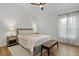 Bedroom with neutral tones, ceiling fan, and bright natural light at 5944 Hickey Way, The Villages, FL 32163